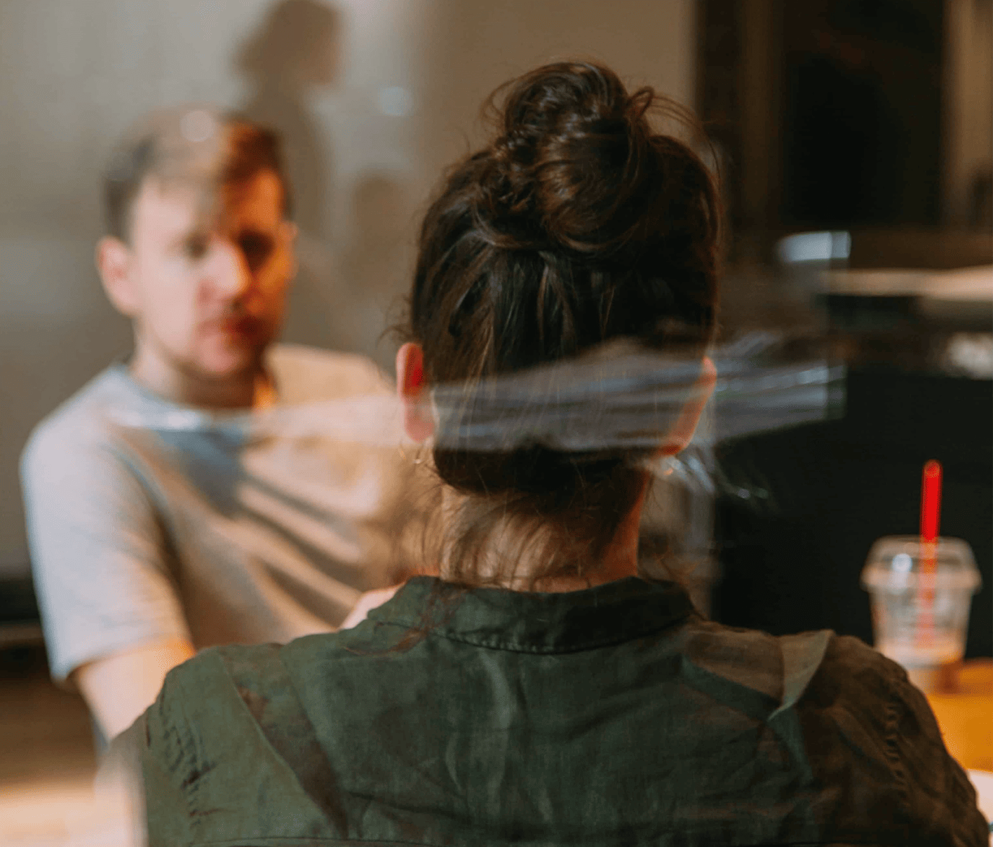 Man and woman at coffee shop. Cybersecurity and compliance