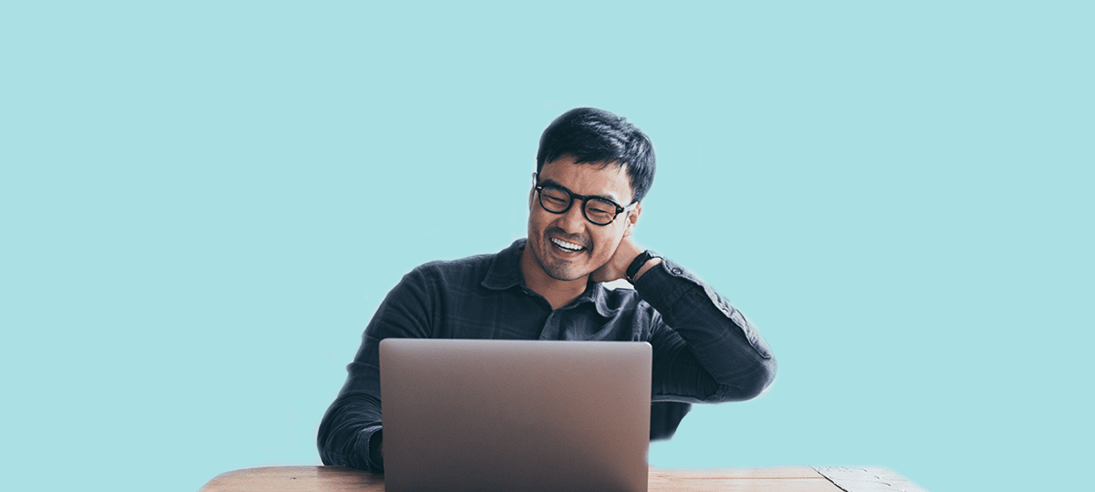 Microsoft Sentinel workshop. Man smiling while working at laptop
